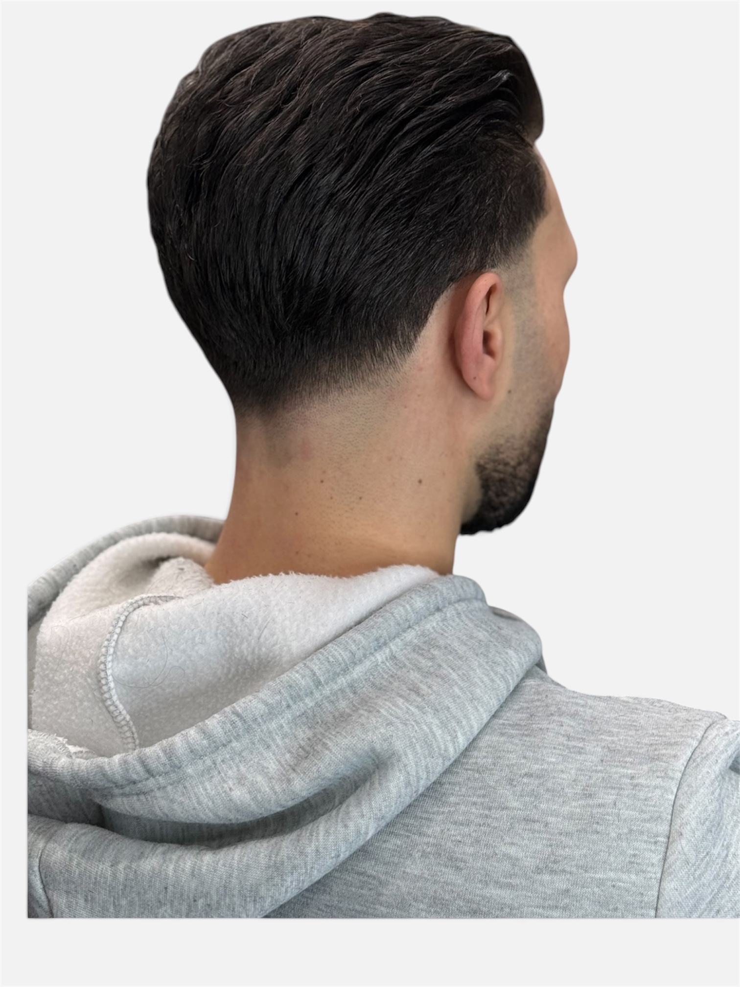 Clean taper fade, back view, at Fortis Barber Shop