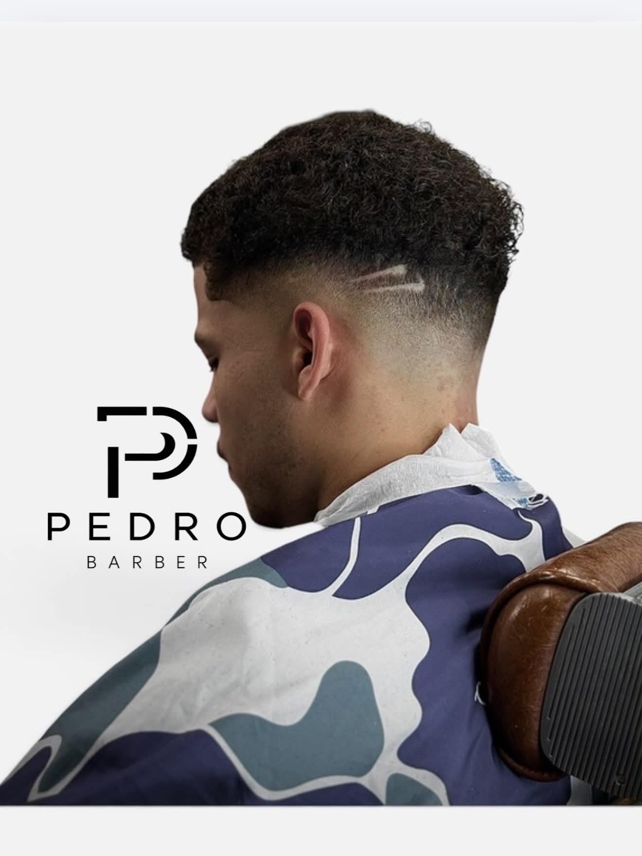 Curly top skin fade with hair design, cut by Pedro